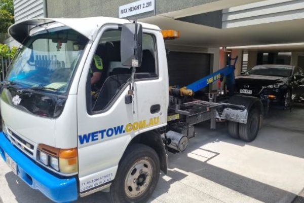 Car getting towed from underground car park